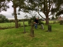 Arthur strimming around gravestones